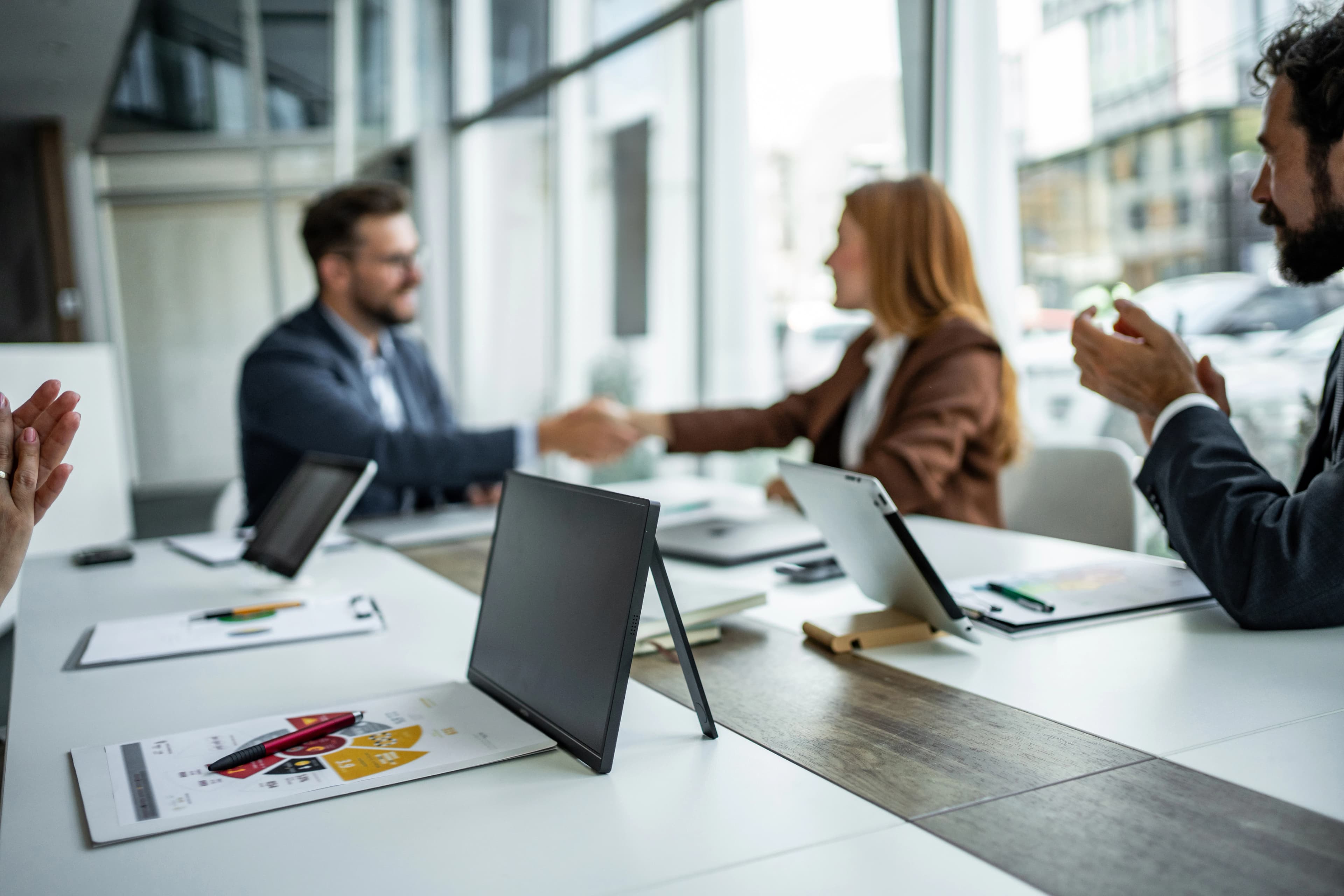 Handshake during a strategic pitch meeting