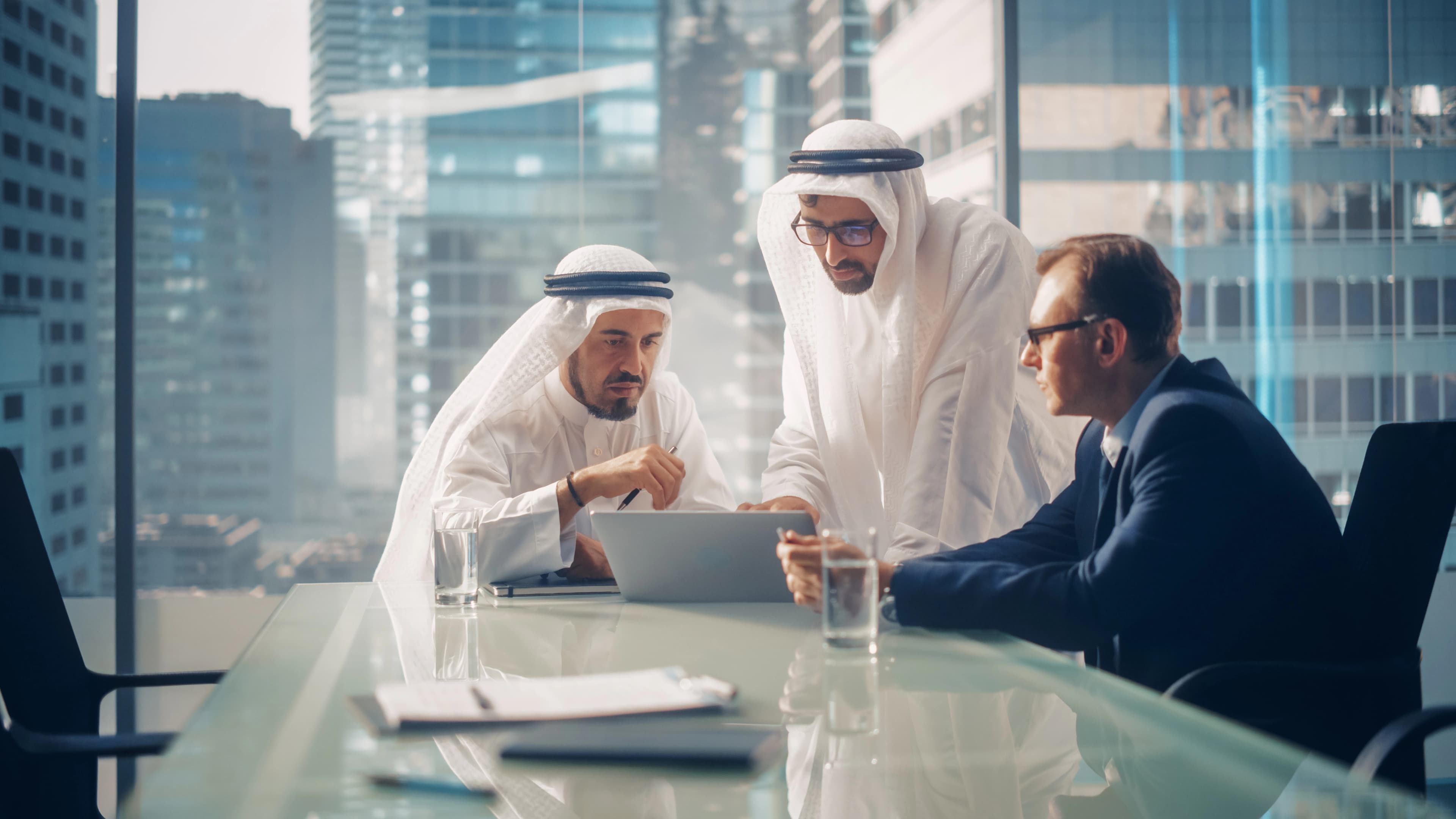 Business partners collaborating across borders in a high-rise office