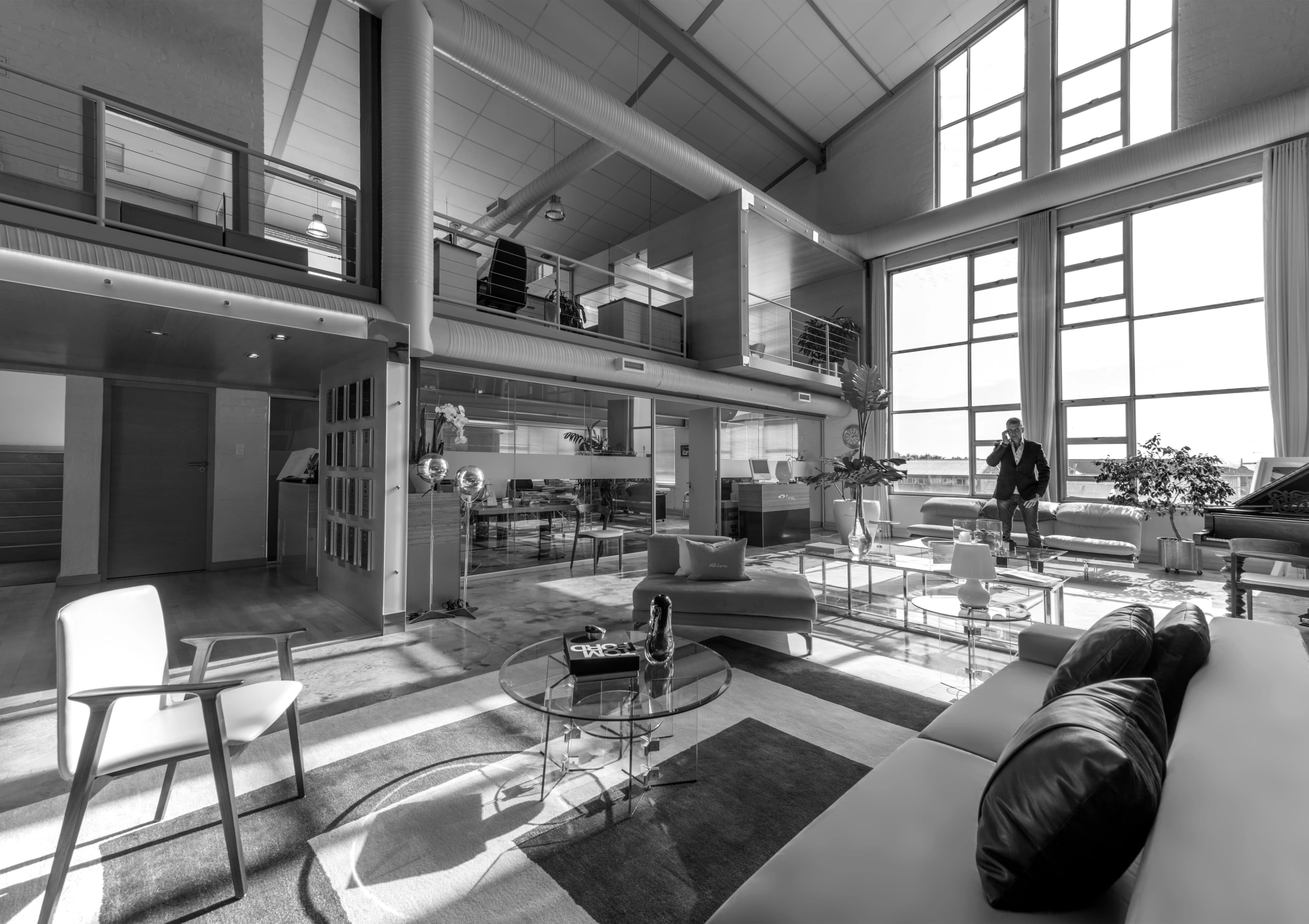 Modern open workspace with large windows and collaborative seating